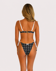 Black and white Flying Fox bikini bottom on model, 5'4" wearing size Small
Back view of black and white bikini bottom from Somewhere On A Yacht
Flying Fox black and white bikini bottom styled on a yacht sundeck
